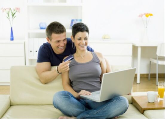 Picture of couple shopping online with credit card