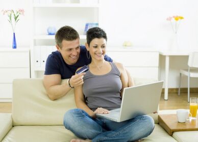 Picture of couple shopping online with credit card